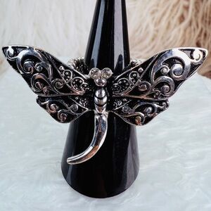 Beautiful, silvertone adjustable stretch, dragonfly statement ring